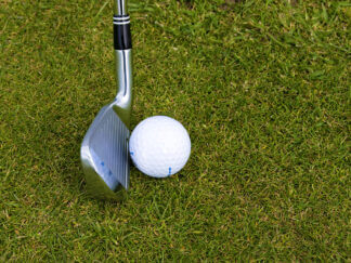 photo of golf club and ball
