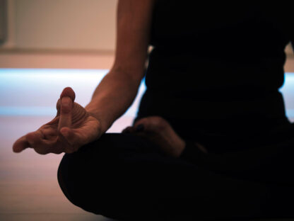 woman sitting in meditation position
