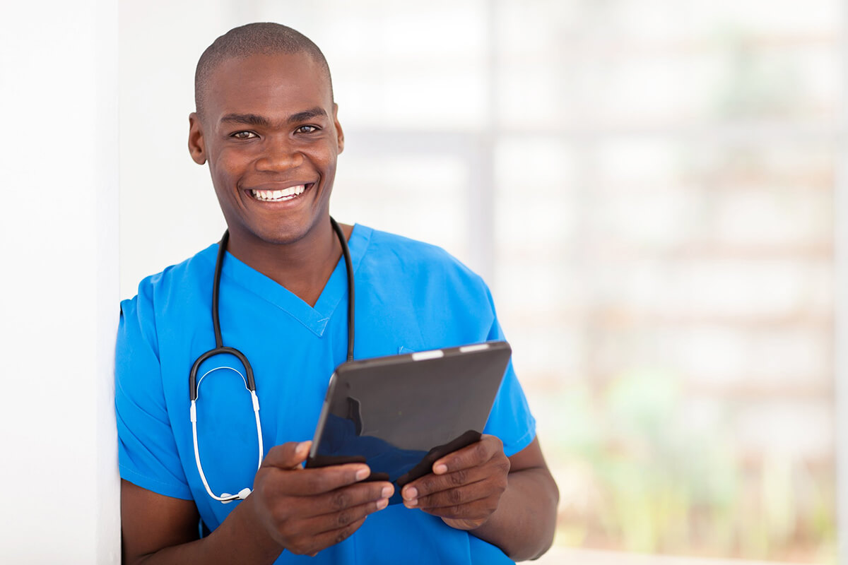 A smiling man with a stethoscope.